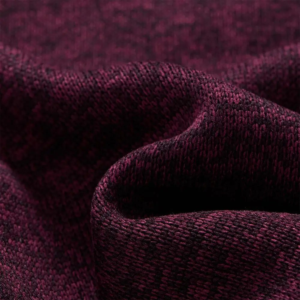 Detailaufnahme des melierten Strickfleece-Materials der Kinderjacke Junior Newhill in lila melange